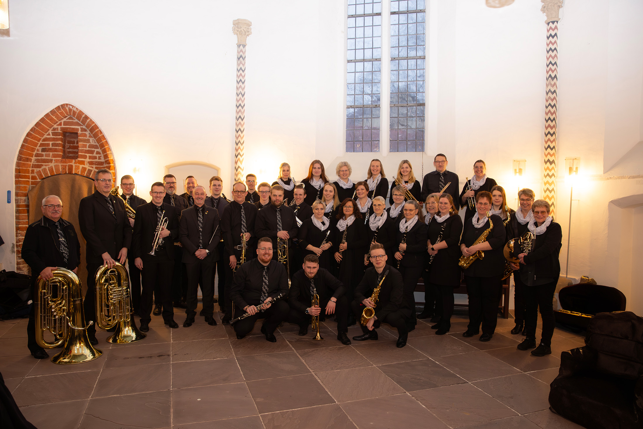 Chris standing up holding his daughter Elva