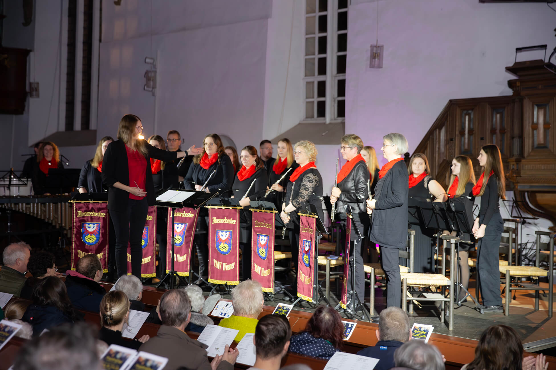 Chris standing up holding his daughter Elva