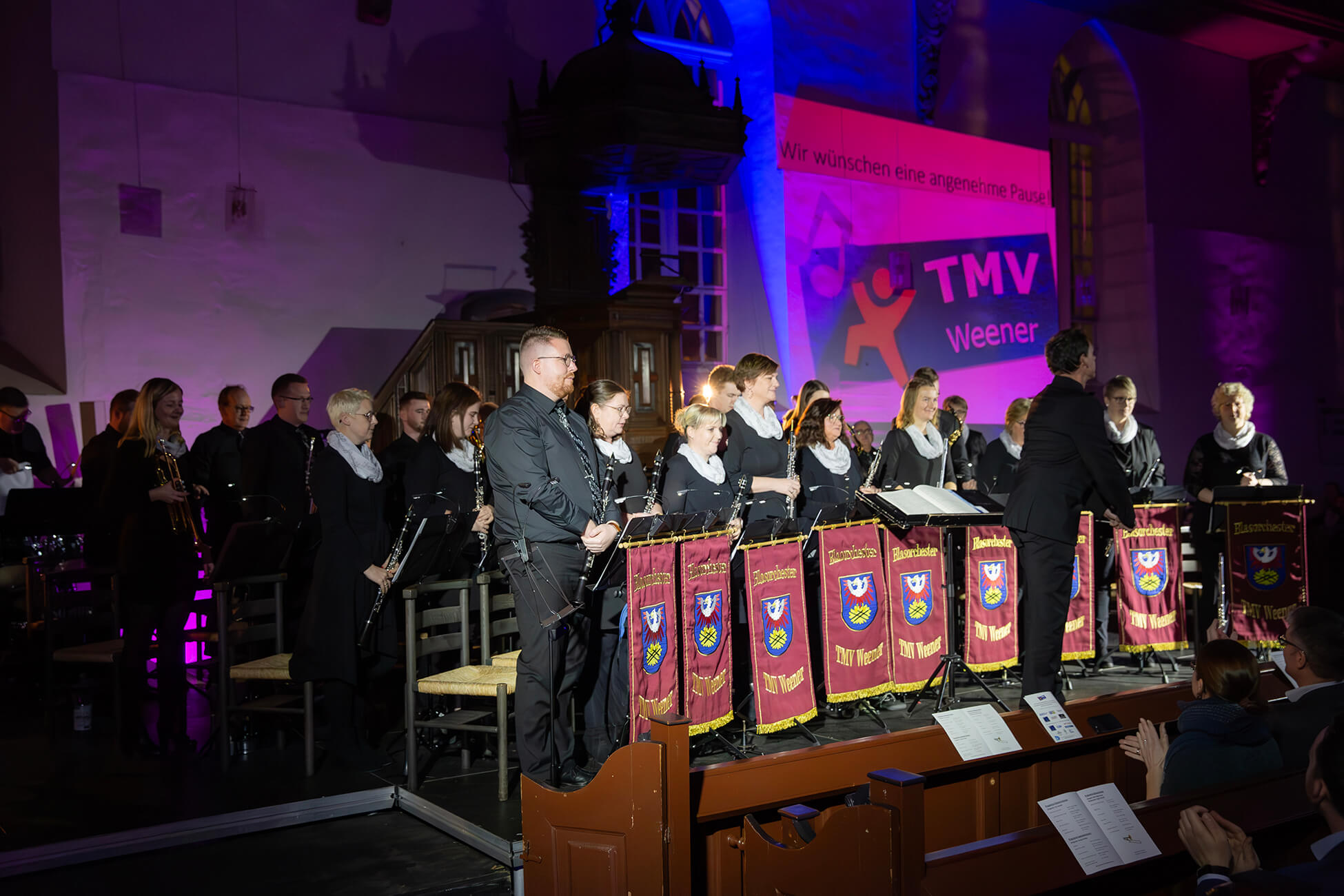 Chris standing up holding his daughter Elva